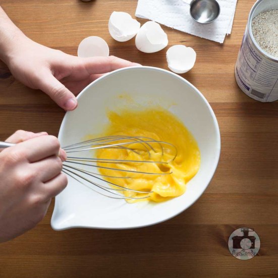 Mix eggs and oil together using a whisk.