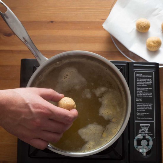 Bring broth in a pot to the boiling point. Reduce heat, drop matzo balls to cook.  Cover tightly and simmer for about 30 minutes.